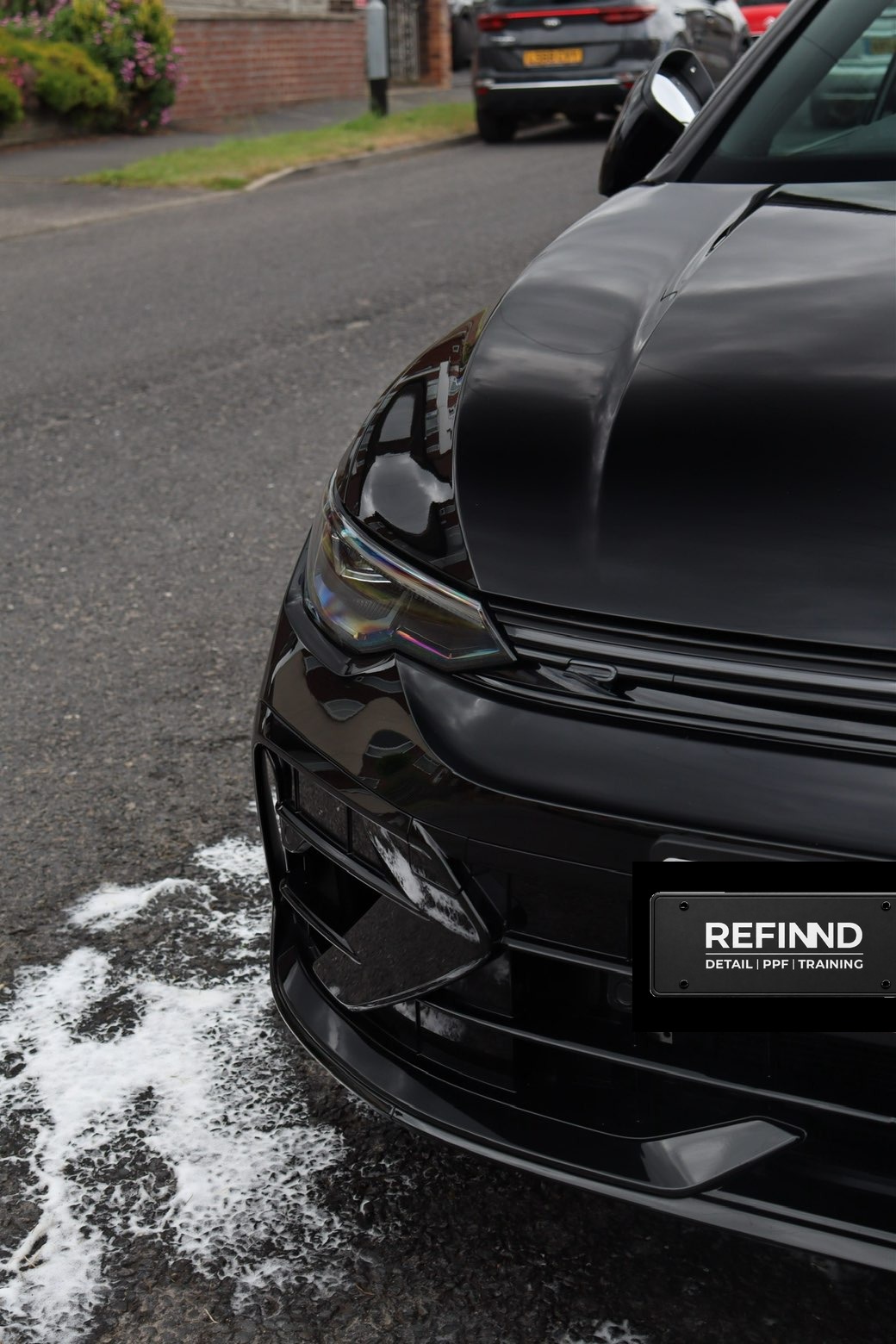 Corrected gloss black paintwork under studio lighting