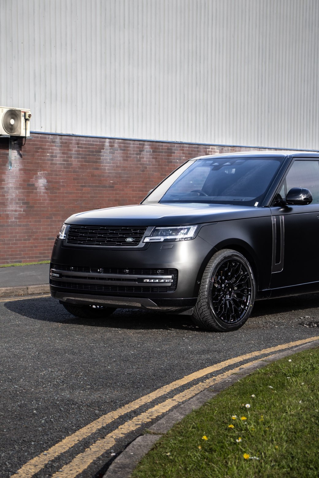 Satin black Range Rover ready for collection outside the studio