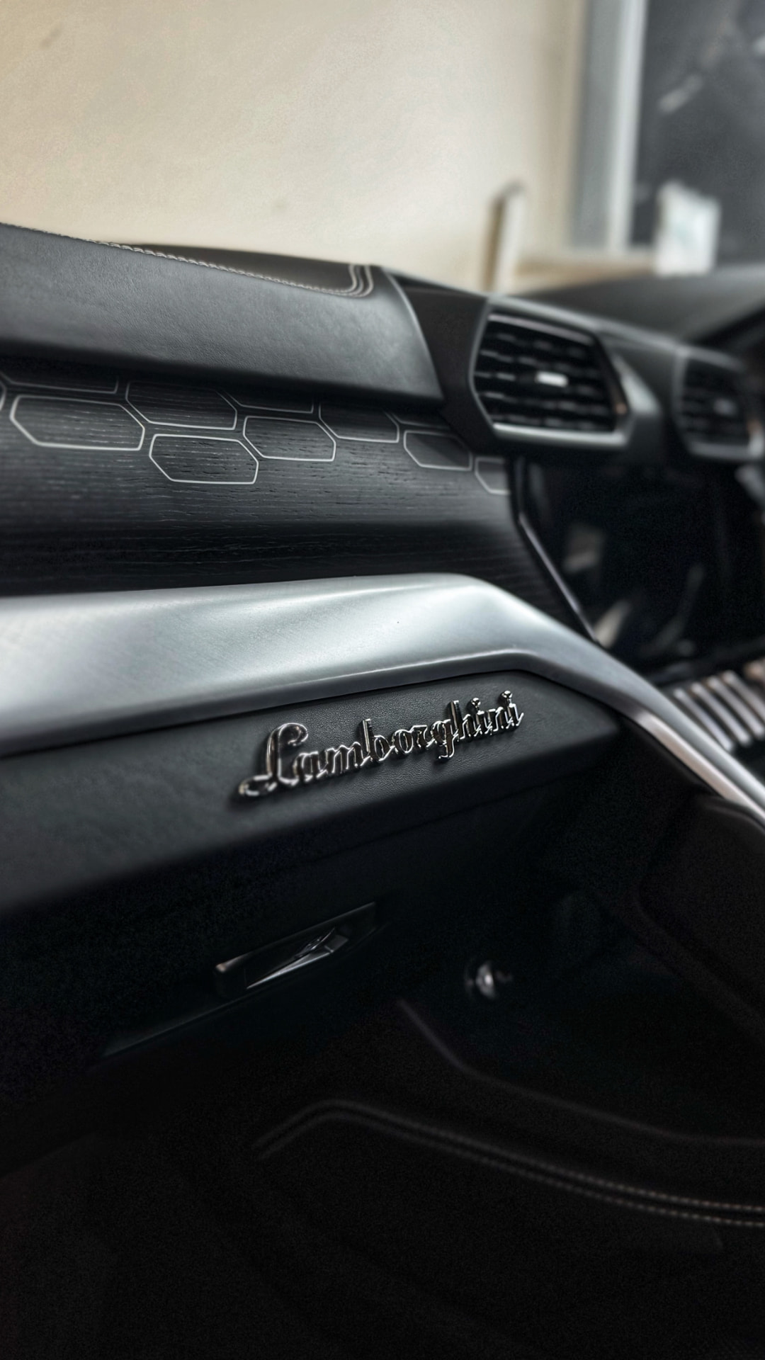 Lamborghini dashboard and door card after an interior detail